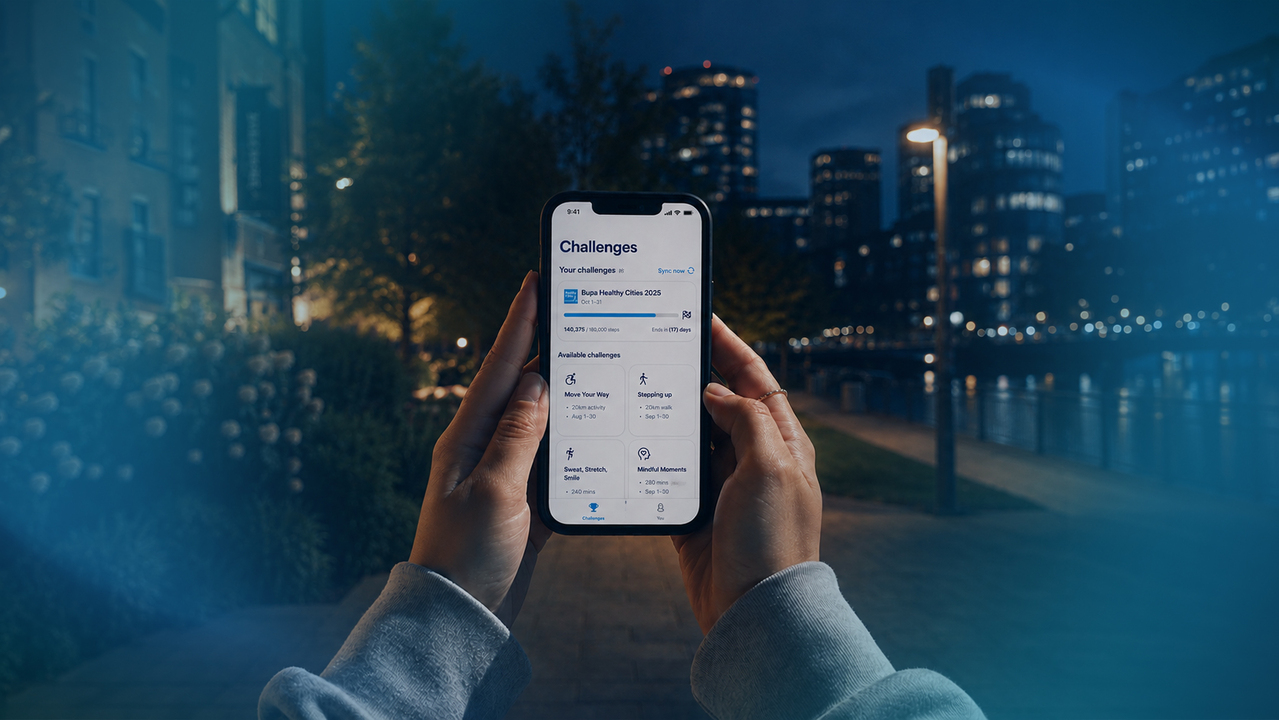 A person holding a phone on Bupa app 
