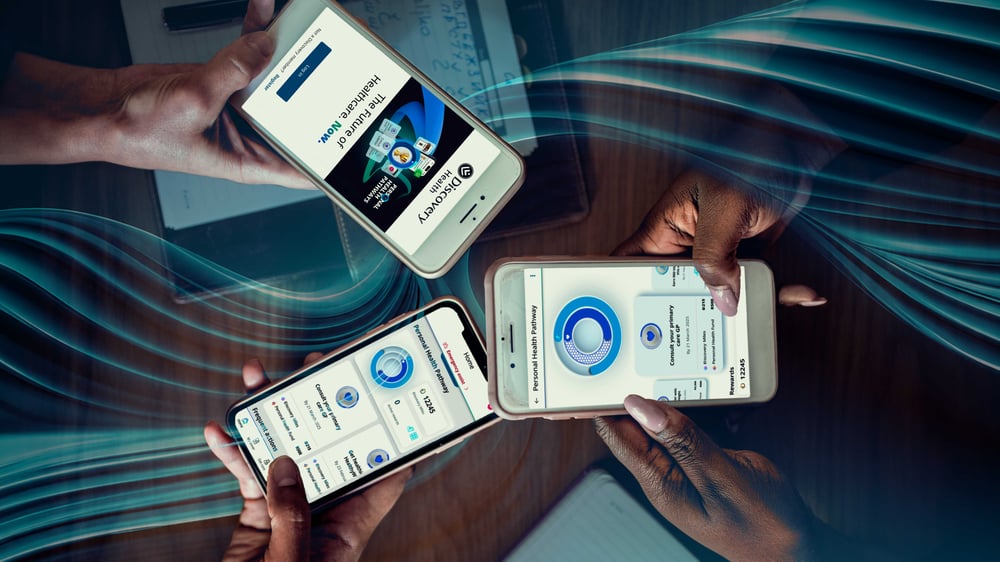 3 people holding cellphones with the Discovery app displaying